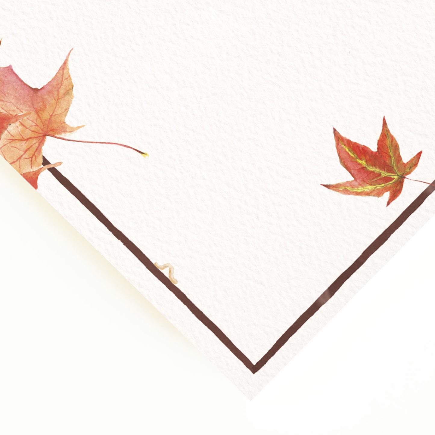 Close-up of the corner of our autumn party menu, showcasing the menu's dark brown border and hand-painted watercolour designs.
