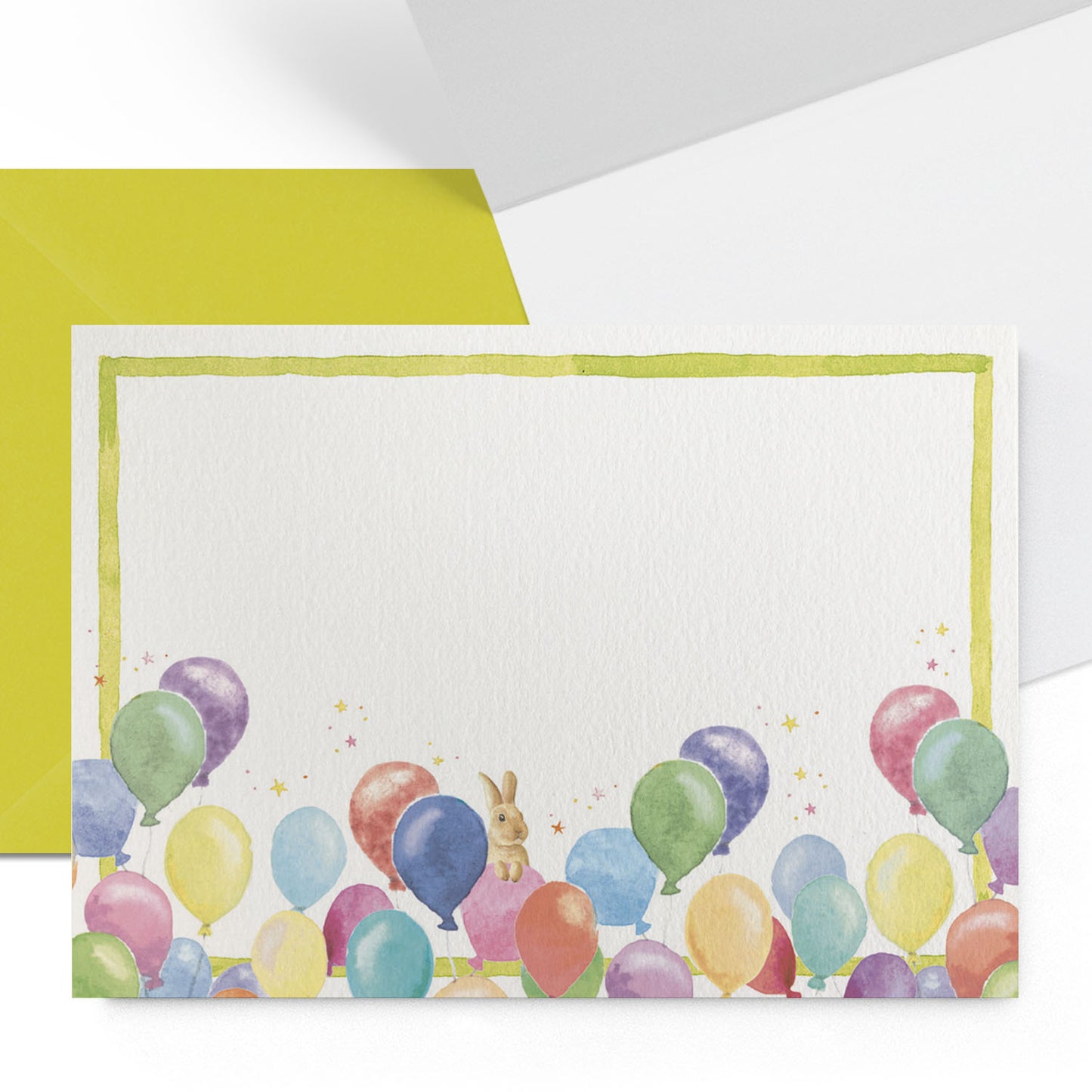Close-up of the outside and inside of a Clementina Sketchbook birthday balloon mini personal stationery card with balloon watercolour designs, a lime green border and a lime green envelope.