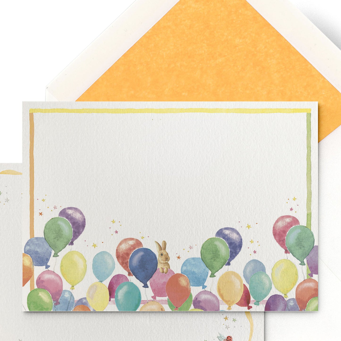 Close-up of Clementina Sketchbook's birthday balloon stationery card, with a balloon watercolour design and yellow tissue envelope.