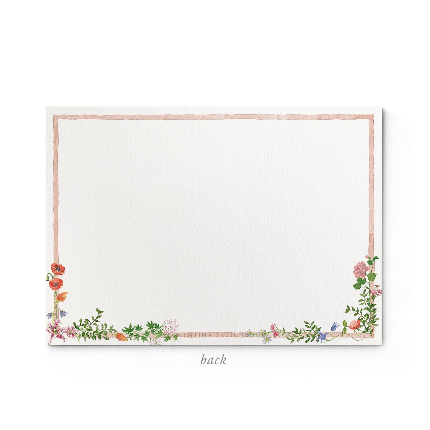 Image shows the back of a Clementina Sketchbook wild bloom stationery card, with a floral watercolour design and a pink border.