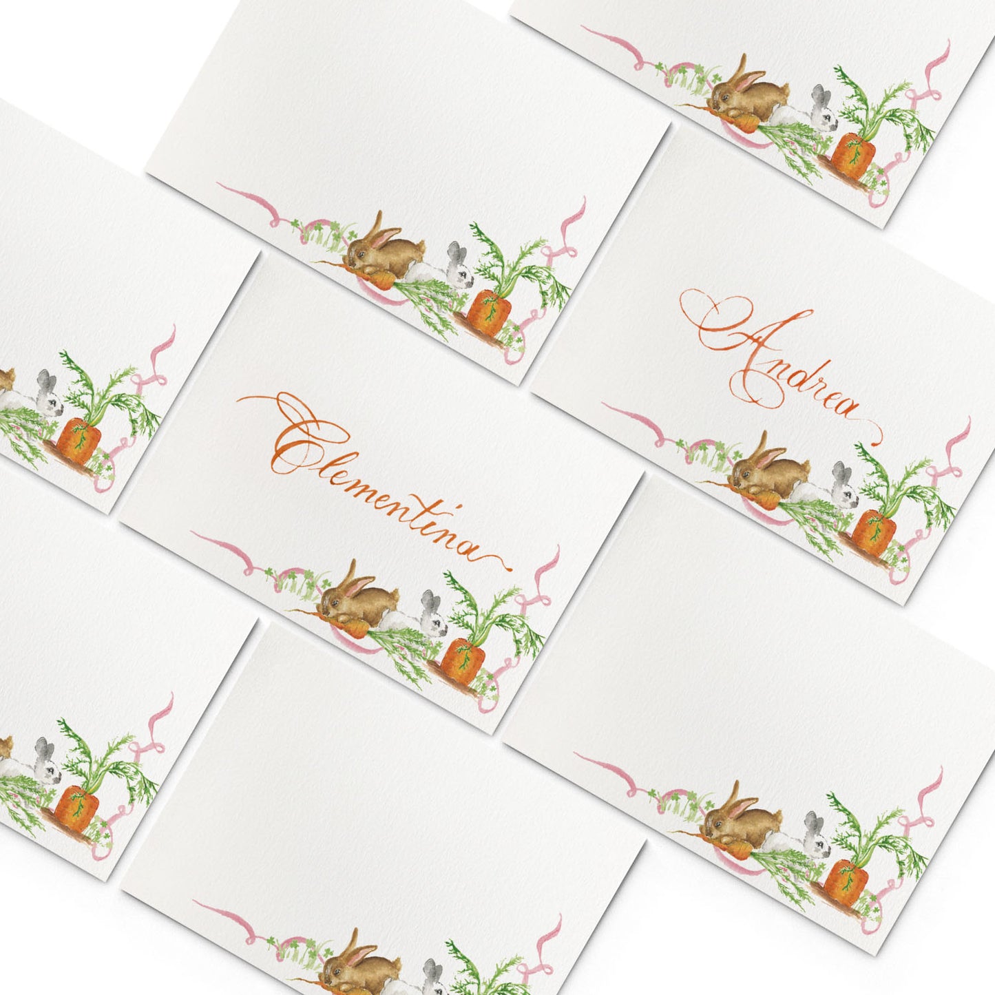 Image of multiple Clementina Sketchbook woodland place cards, featuring hand-painted designs of bunnies and carrots.
