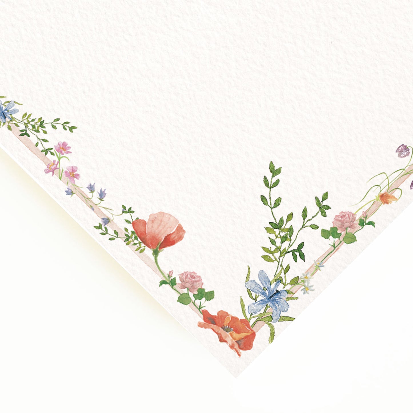 Close-up of the corner of our wildflowers menu, the perfect personalised wedding menu, showcasing the multicoloured floral detailing.