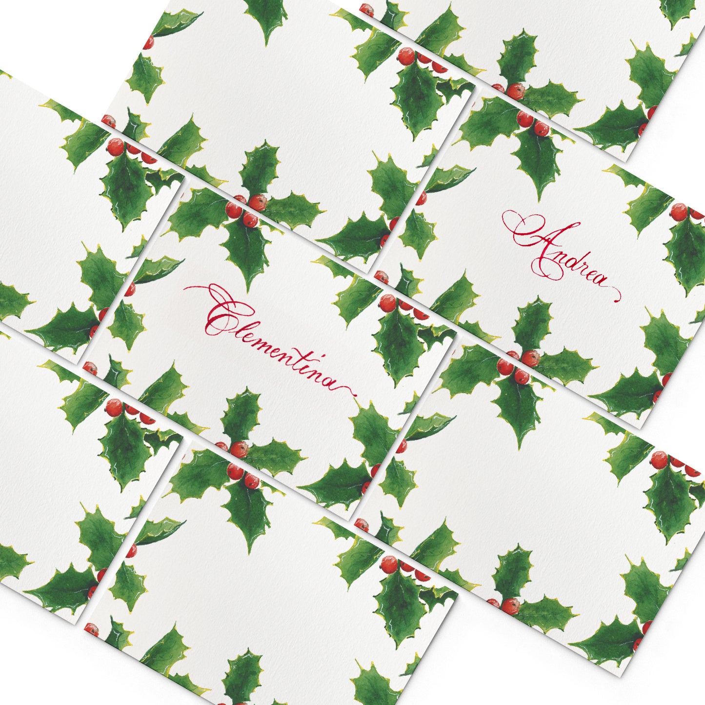 Image of multiple Clementina Sketchbook elegant place cards, featuring hand-painted holly designs.