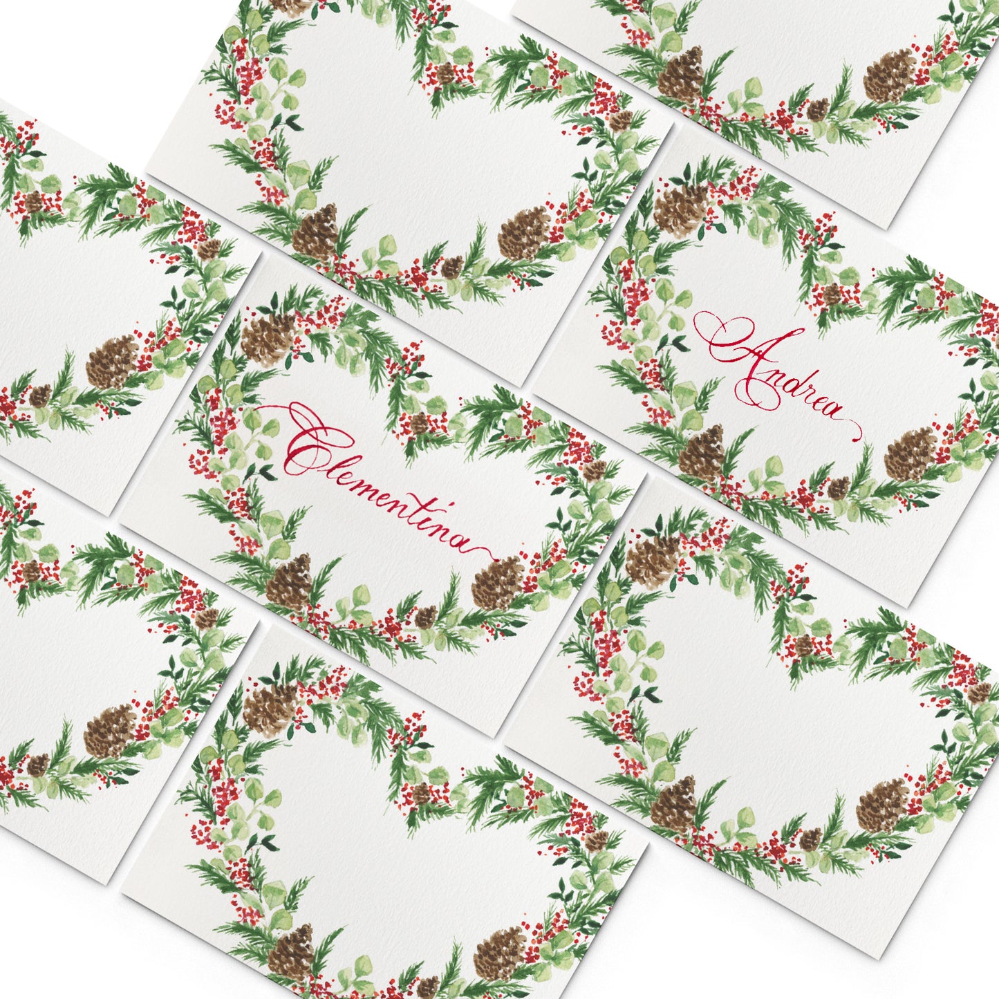 Image of multiple Clementina Sketchbook elegant place cards, featuring hand-painted designs of holiday wreaths.