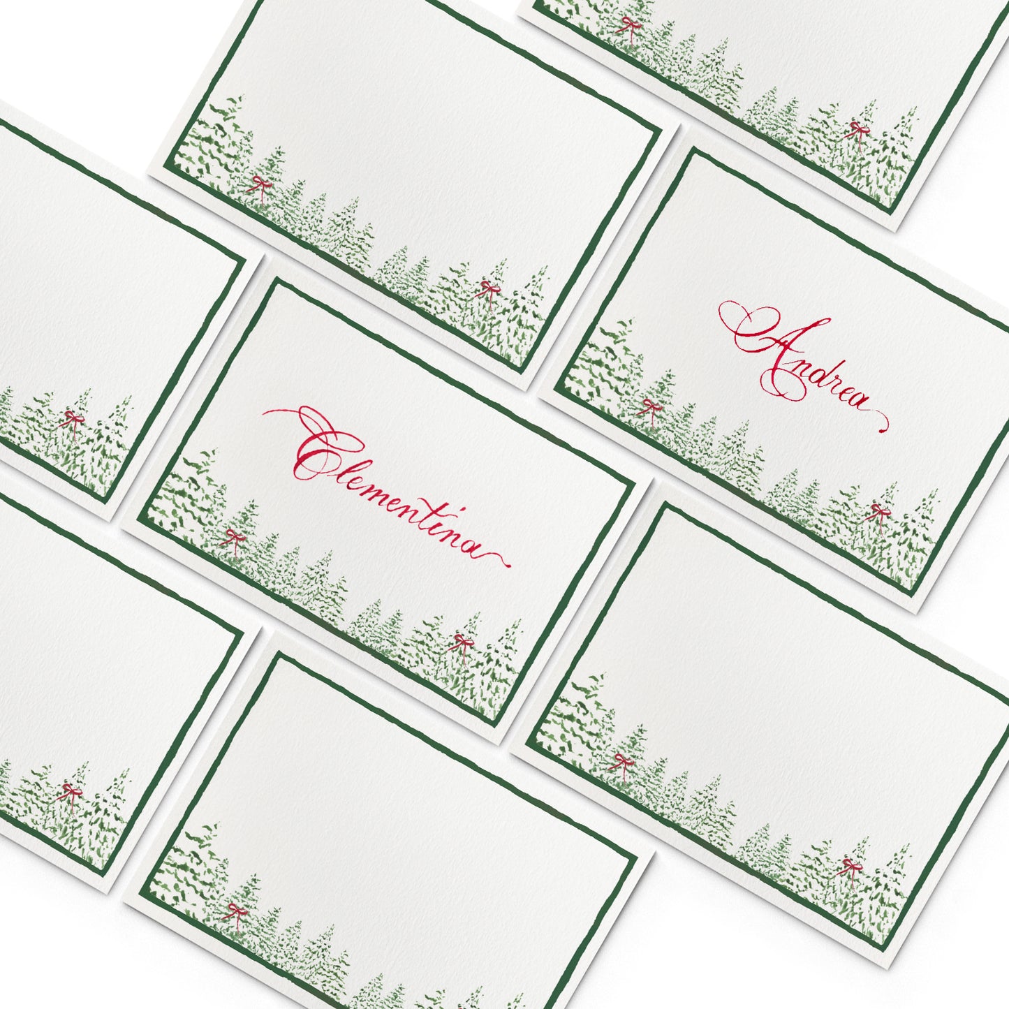 Image of multiple Clementina Sketchbook festive place cards, featuring hand-painted designs of pine trees.