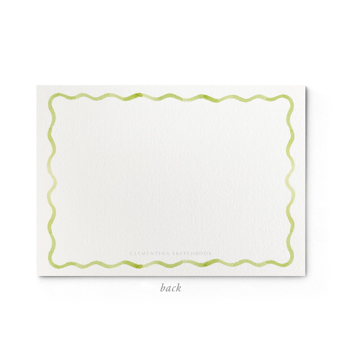 Image shows the back of a Clementina Sketchbook children's stationery card, with a candy watercolour design and a light green border.