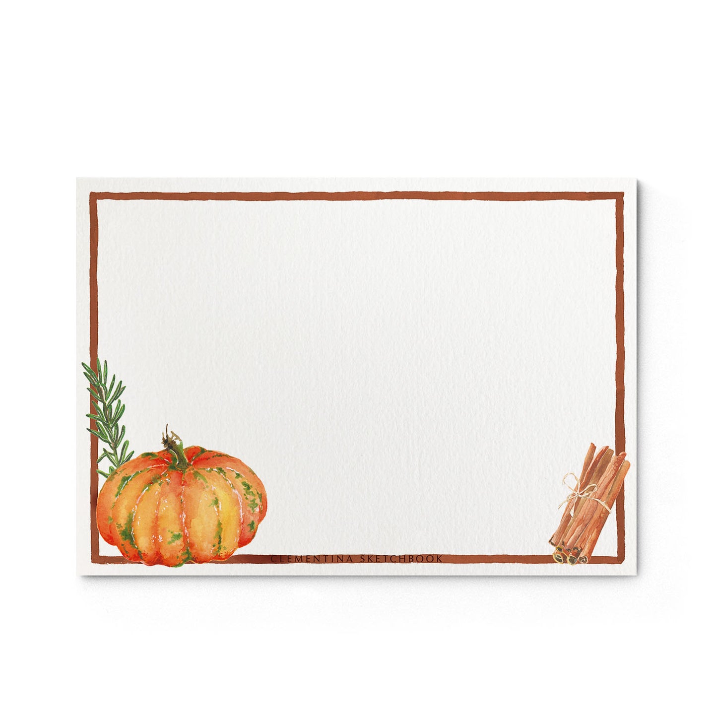 Image shows the back of a Clementina Sketchbook autumnal garden stationery card, with pumpkin and seasonal fruits watercolour design and a dark pink border.