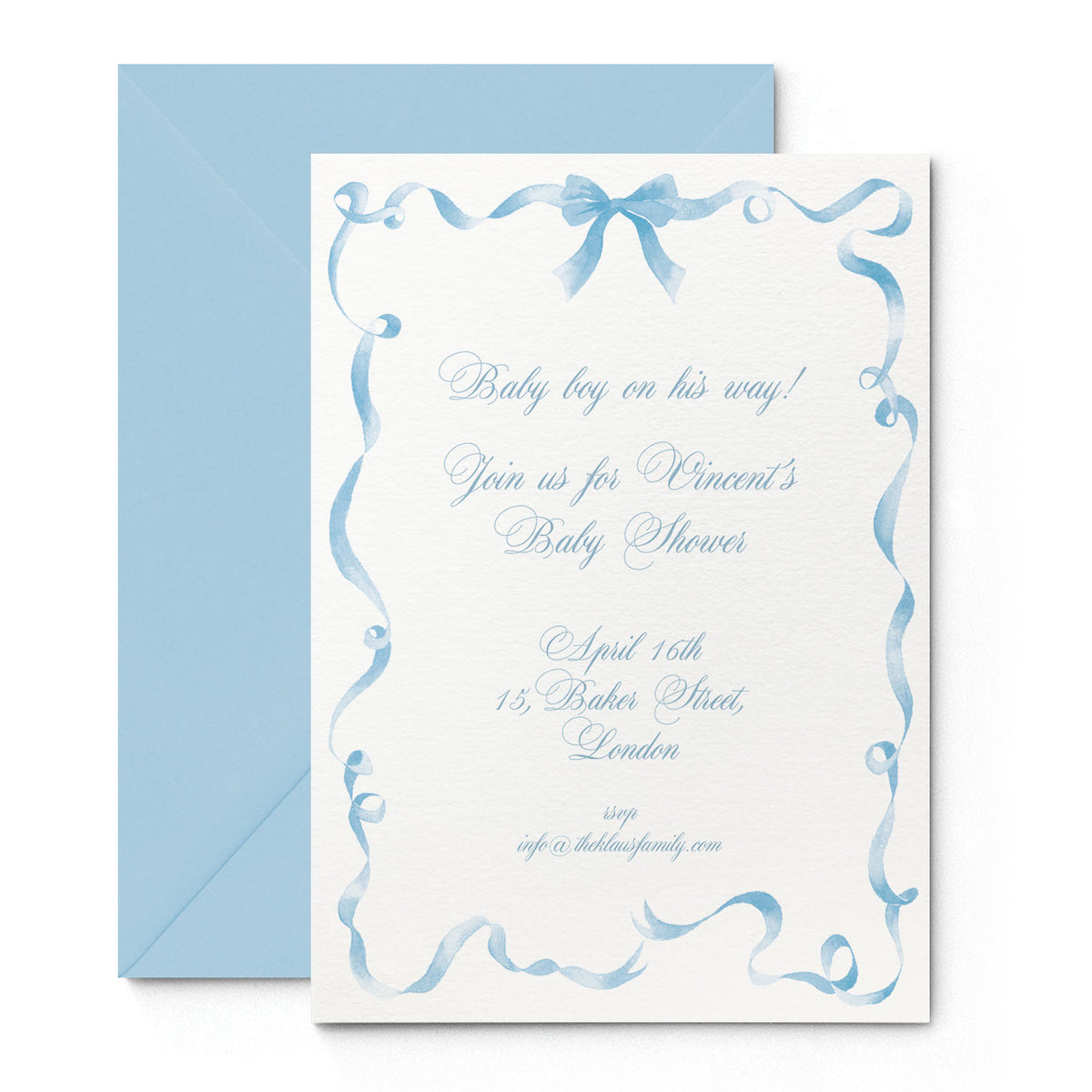 Image of Clementina Sketchbook's festive ribbon printed birth announcement with a blue ribbon border, personalised text and a blue envelope.