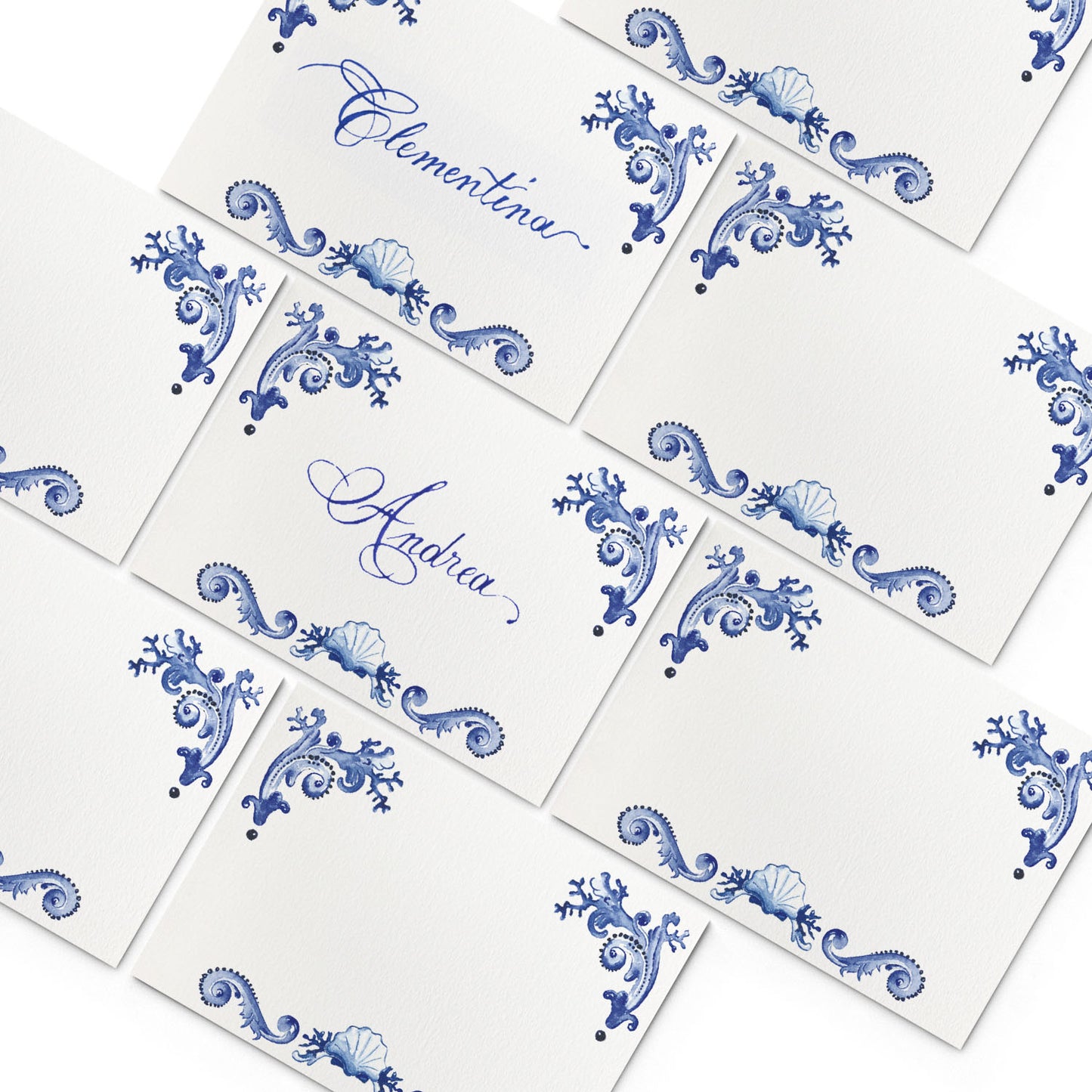 Image of multiple Clementina Sketchbook elegant place cards, featuring blue and white hand-painted designs.