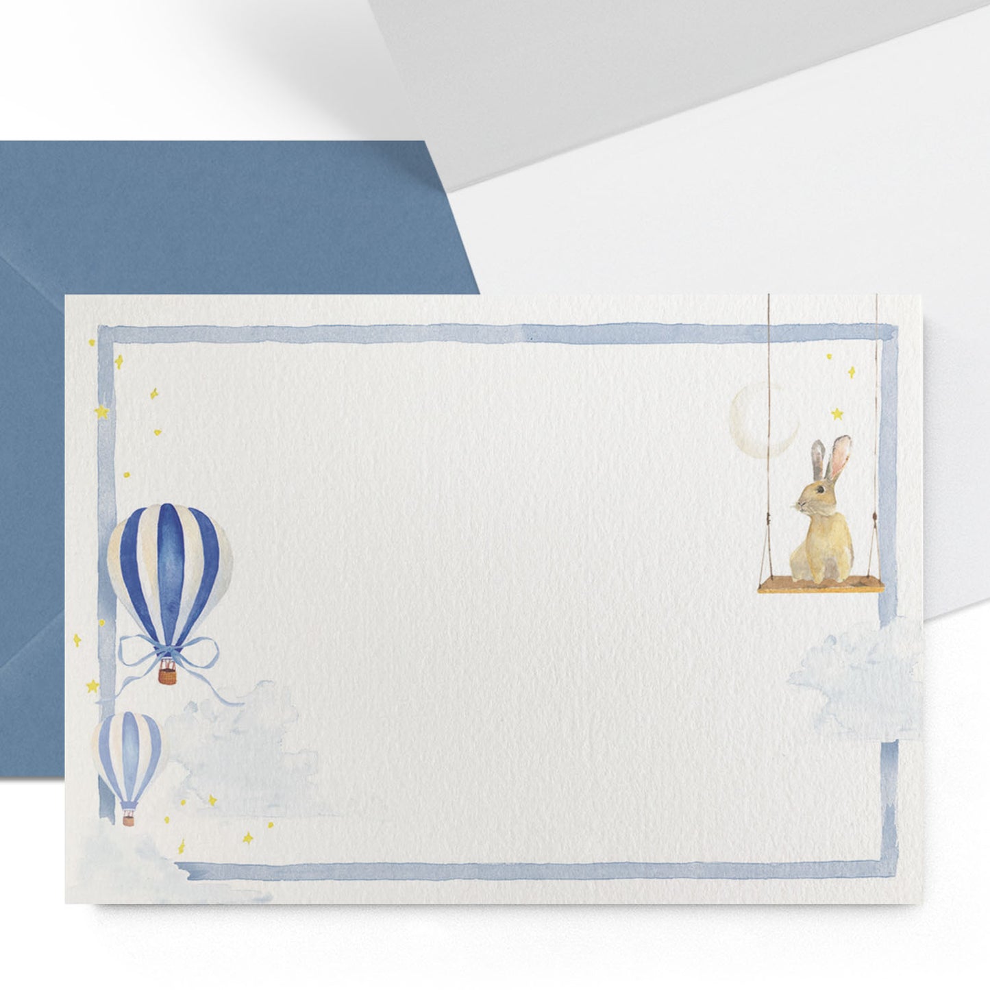 Close-up of the outside and inside of a Clementina Sketchbook hot air balloon mini personal stationery card with balloon watercolour designs, a dark blue border and a dark blue envelope.