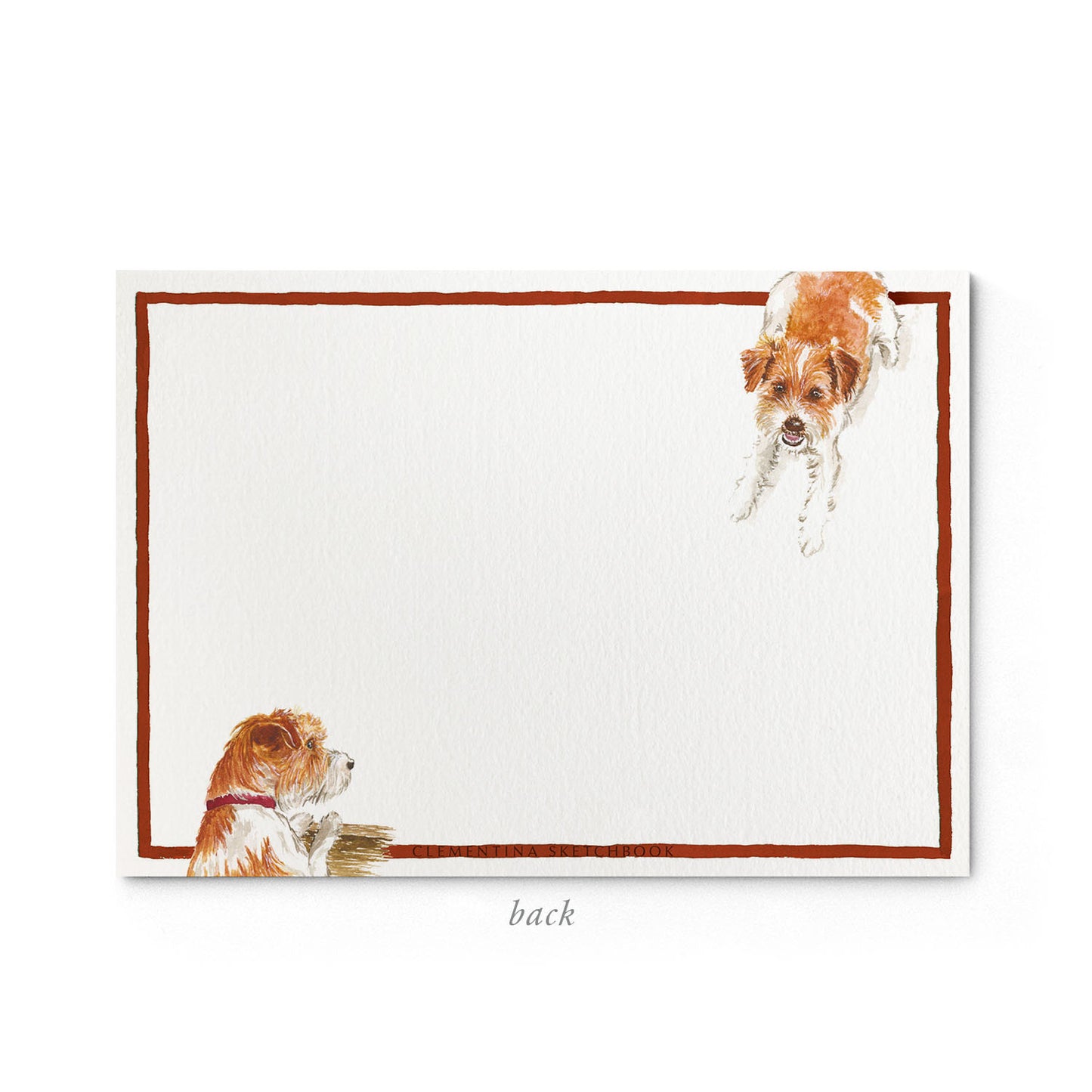 Image shows the back of a Clementina Sketchbook dog stationery card, with a jack russell watercolour design and a dark orange border.