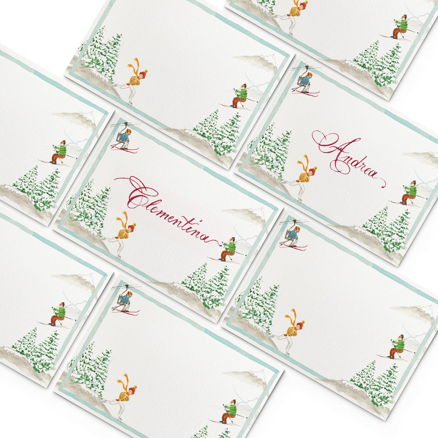 Image of multiple Clementina Sketchbook alpine place cards, featuring hand-painted designs of pine trees and skiers.