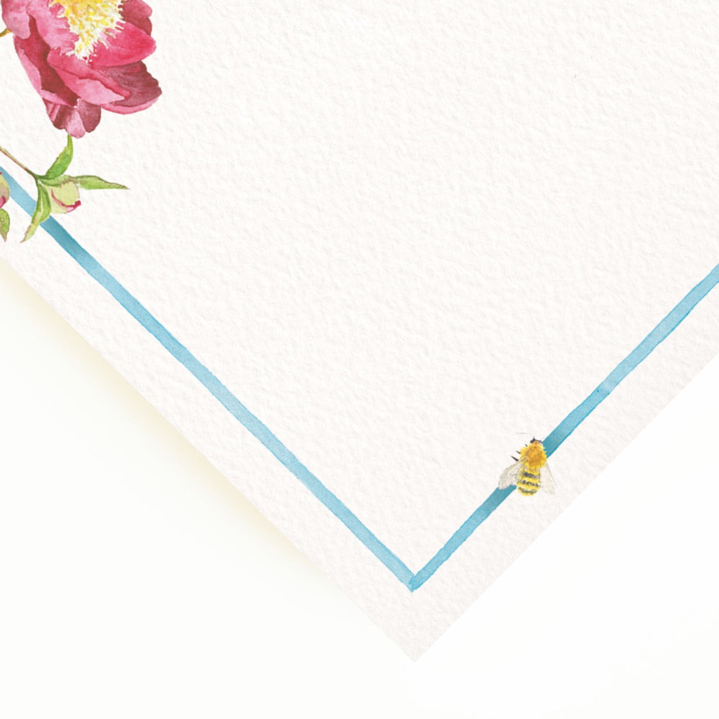 Close-up of the corner of our peony menu, the perfect personalised wedding menu, showcasing the multicoloured floral detailing and blue border.