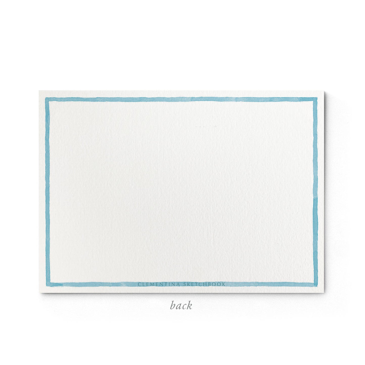 Image shows the back of a Clementina Sketchbook floral stationery card, with a peony watercolour design and a light blue border.