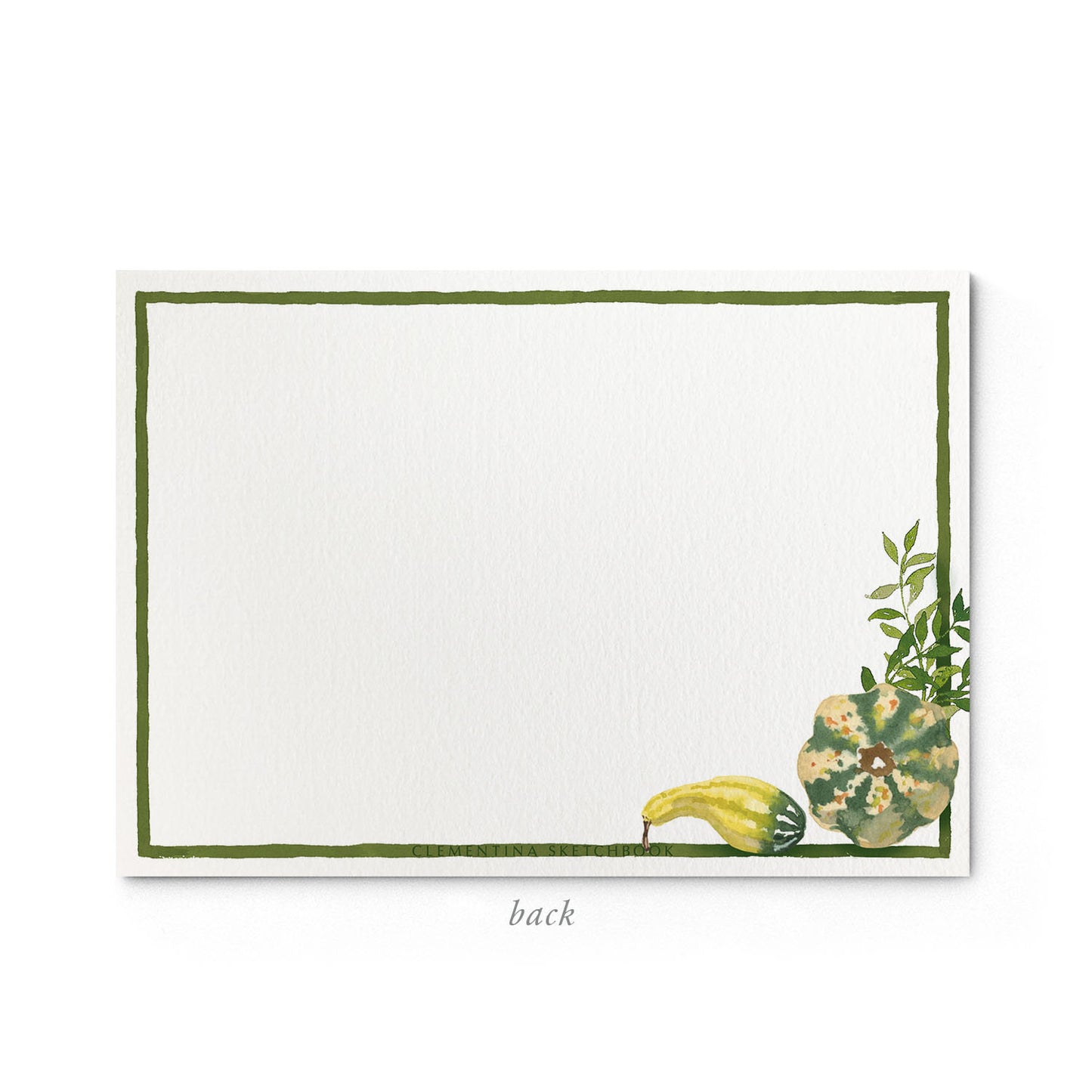 Image shows the back of a Clementina Sketchbook autumnal garden stationery card, with pumpkin watercolour design and a green border.