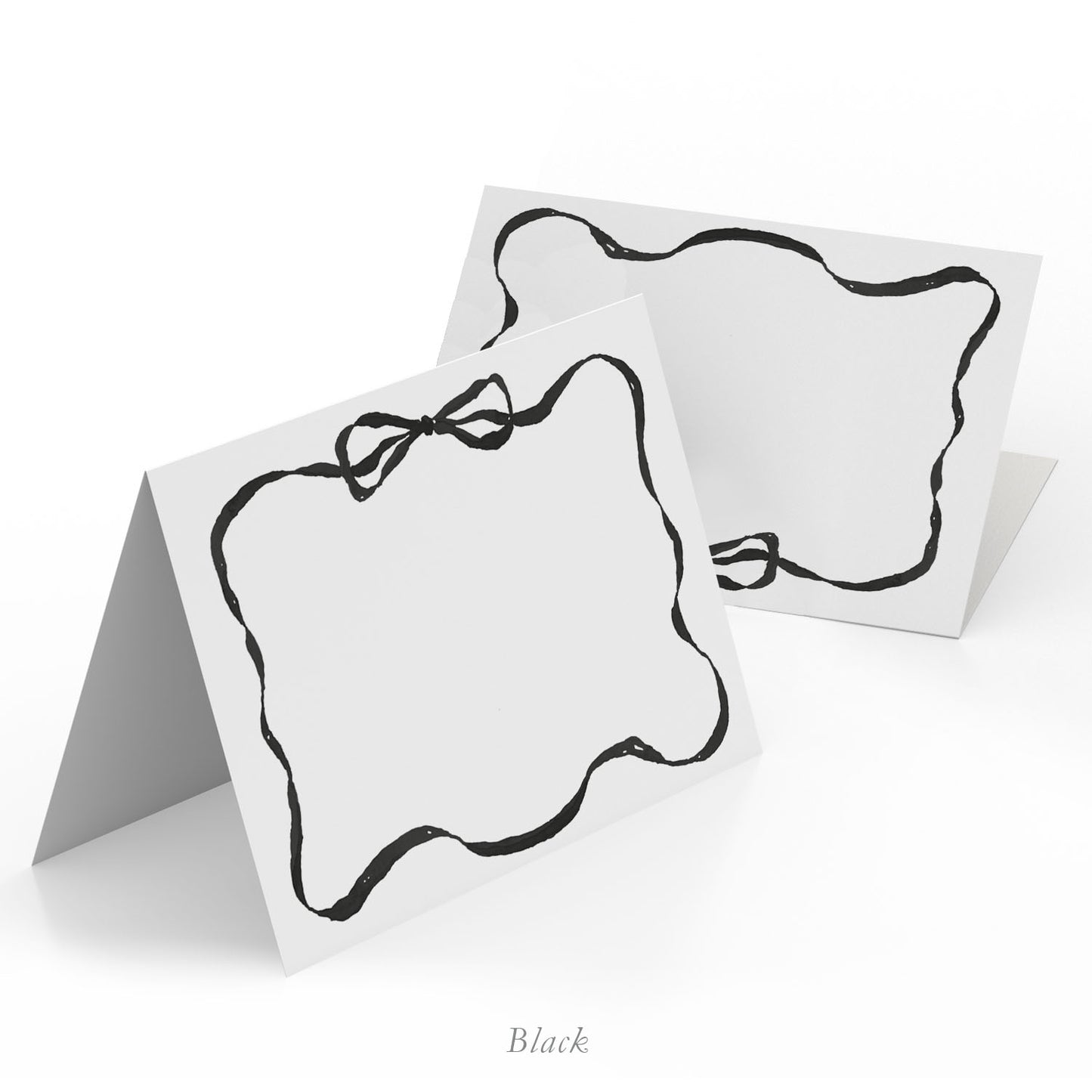 Image of two Clementina Sketchbook place cards with ribbon, featuring a black border and hand-painted designs.