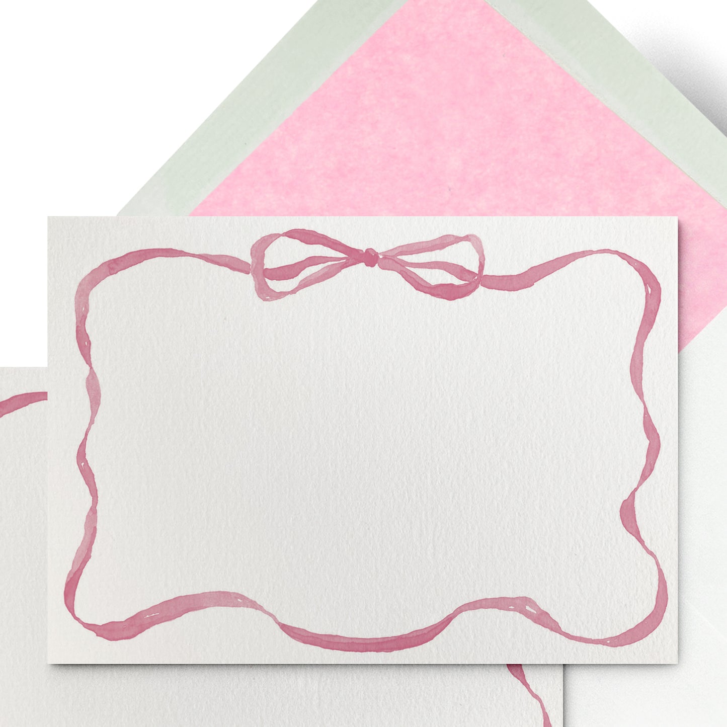 Image of the front and back of Clementina Sketchbook's ribbon stationery card with a light pink tissue envelope.