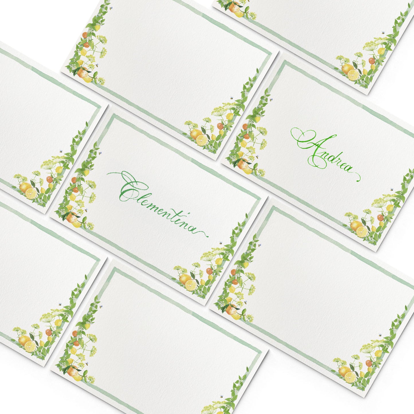 Image of multiple Clementina Sketchbook summer place cards, featuring green borders and hand-painted designs of lemons and leaves.
