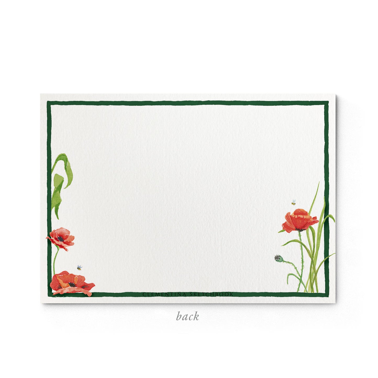 Image shows the back of a Clementina Sketchbook floral stationery card, with a poppy watercolour design and a dark green border.