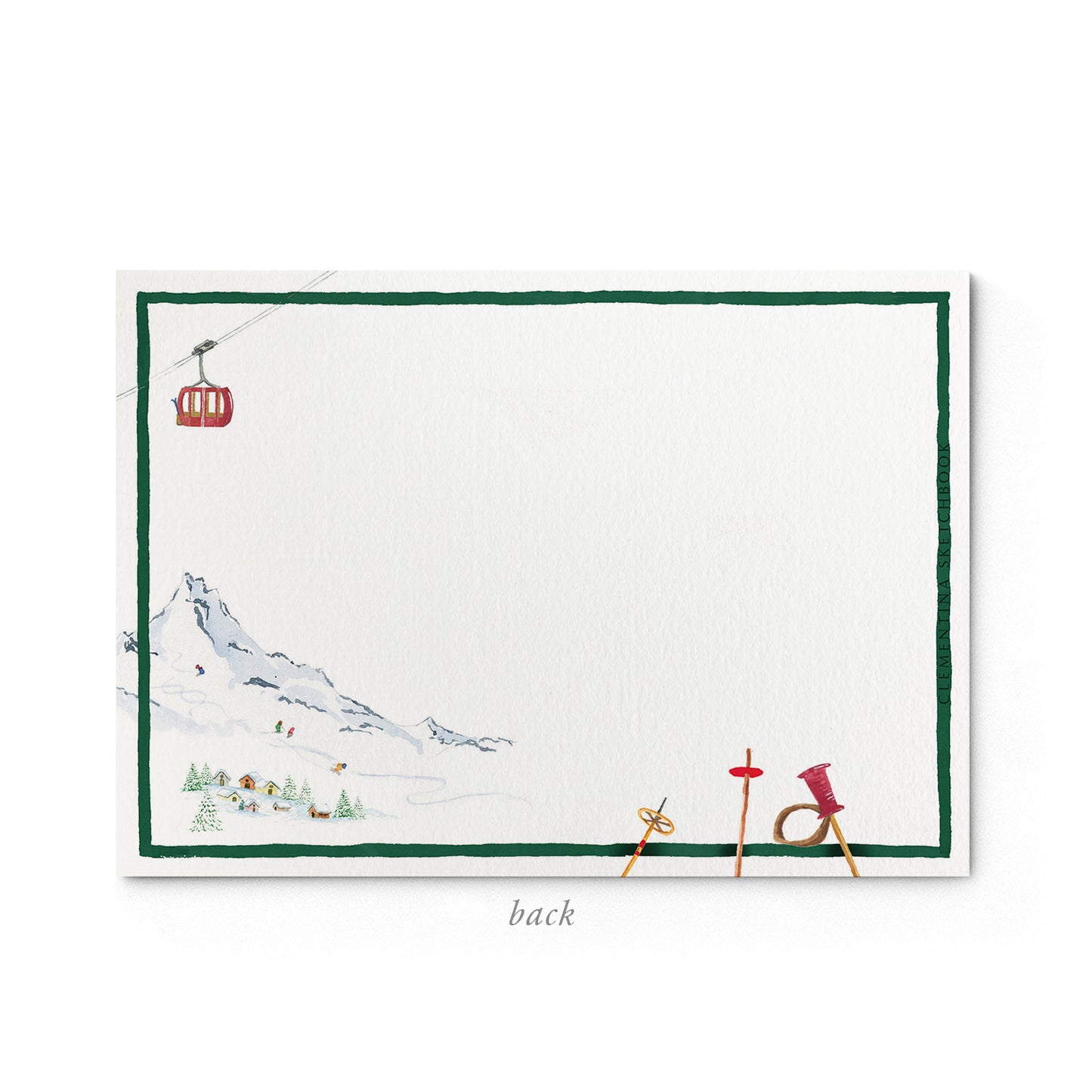 Image shows the back of a Clementina Sketchbook mountain stationery card, with an alpine watercolour design and a dark green border.