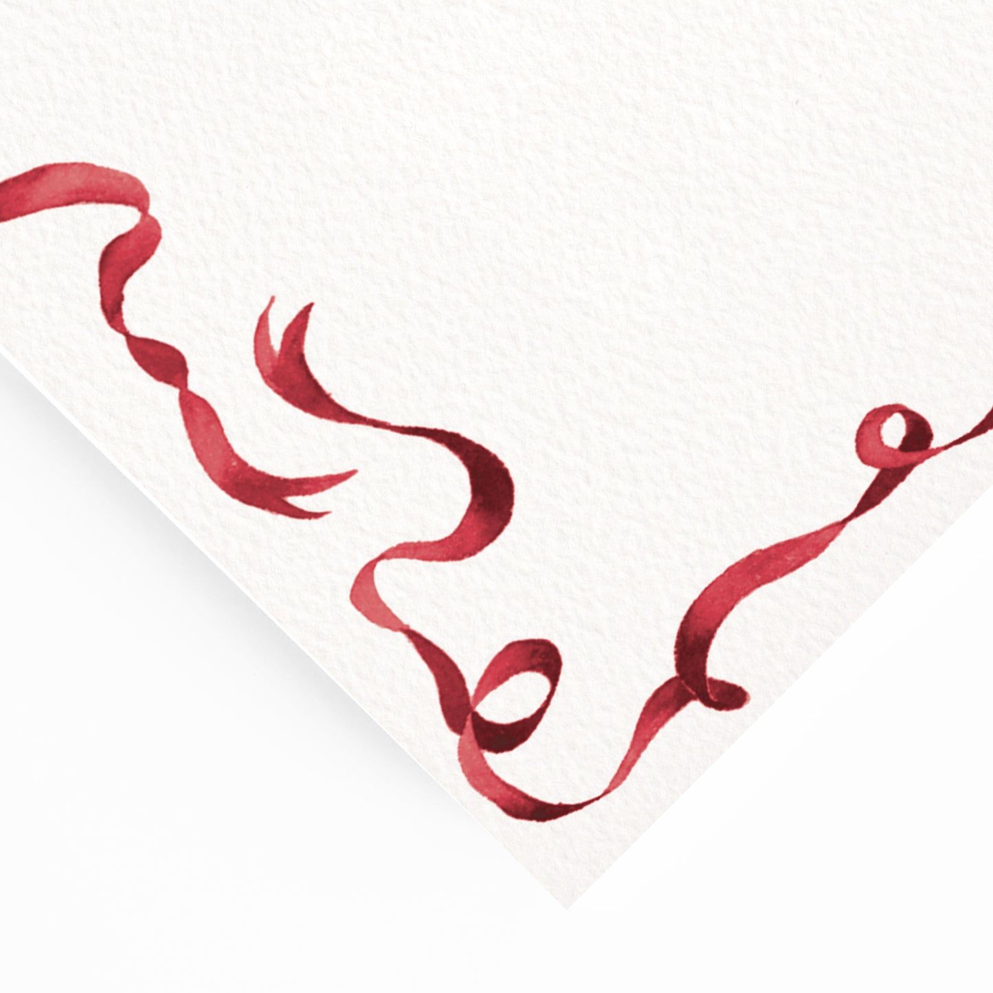 Close-up of the corner of our festive dinner menu, showcasing the menu's dark red ribbon border and hand-painted watercolour designs.