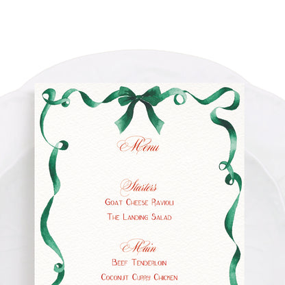Close-up of our ribbon festive dinner menu, featuring personalised text and a curled green ribbon border - our hand-painted watercolour design.