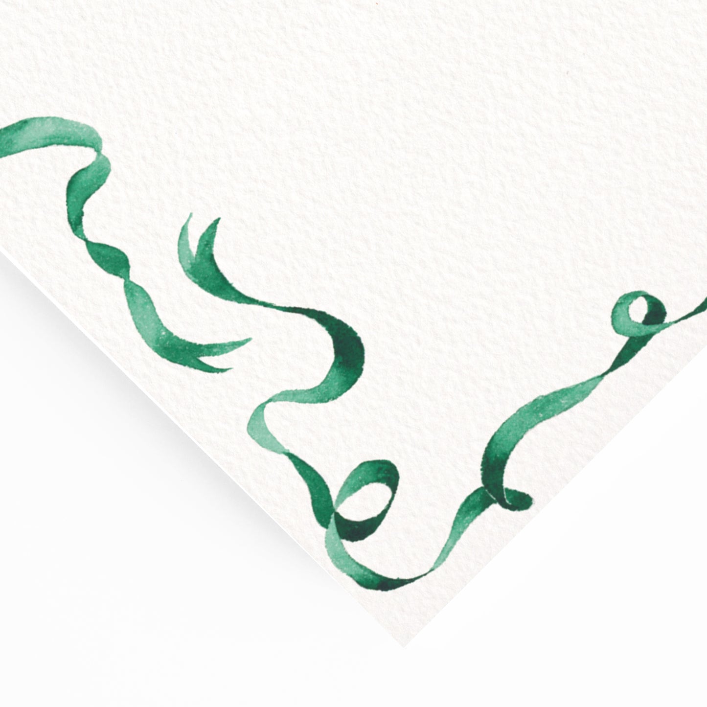 Close-up of our ribbon festive dinner menu, featuring a curled green ribbon border - our hand-painted watercolour design.