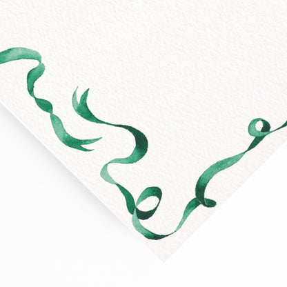 Close-up of our ribbon festive dinner menu, featuring a curled green ribbon border - our hand-painted watercolour design.