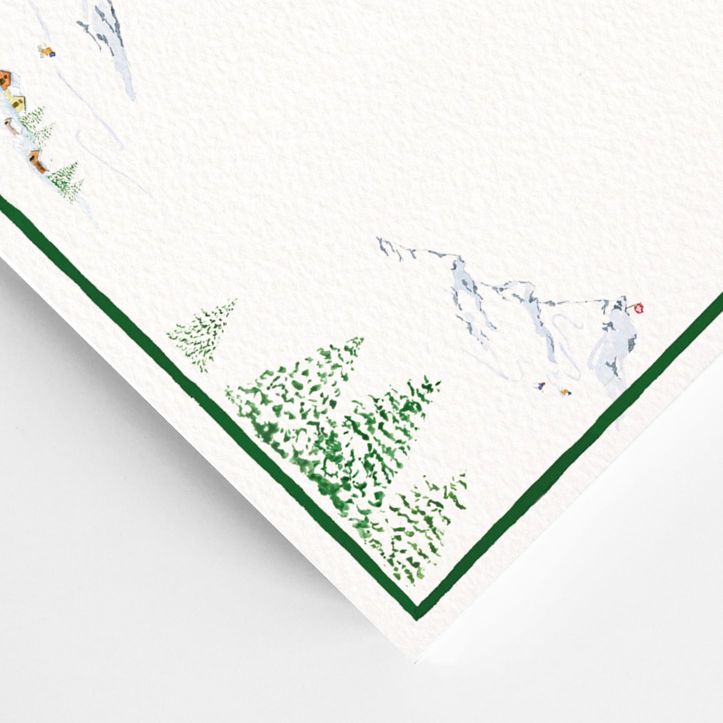Close-up of the corner of our holiday dinner menu, showcasing the green winter tree detailing.