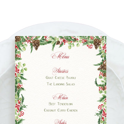Close-up of our festive holiday menu, featuring a wreath-style border, with hand-painted watercolour designs.