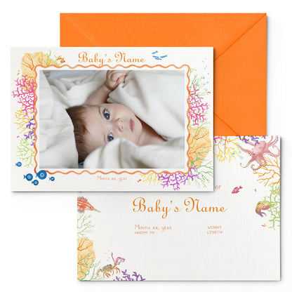 Image of both sides of Clementina Sketchbook's coral reef printed birth announcement with a reef border, personalised text, space for a baby photo to be stuck and an orange envelope.