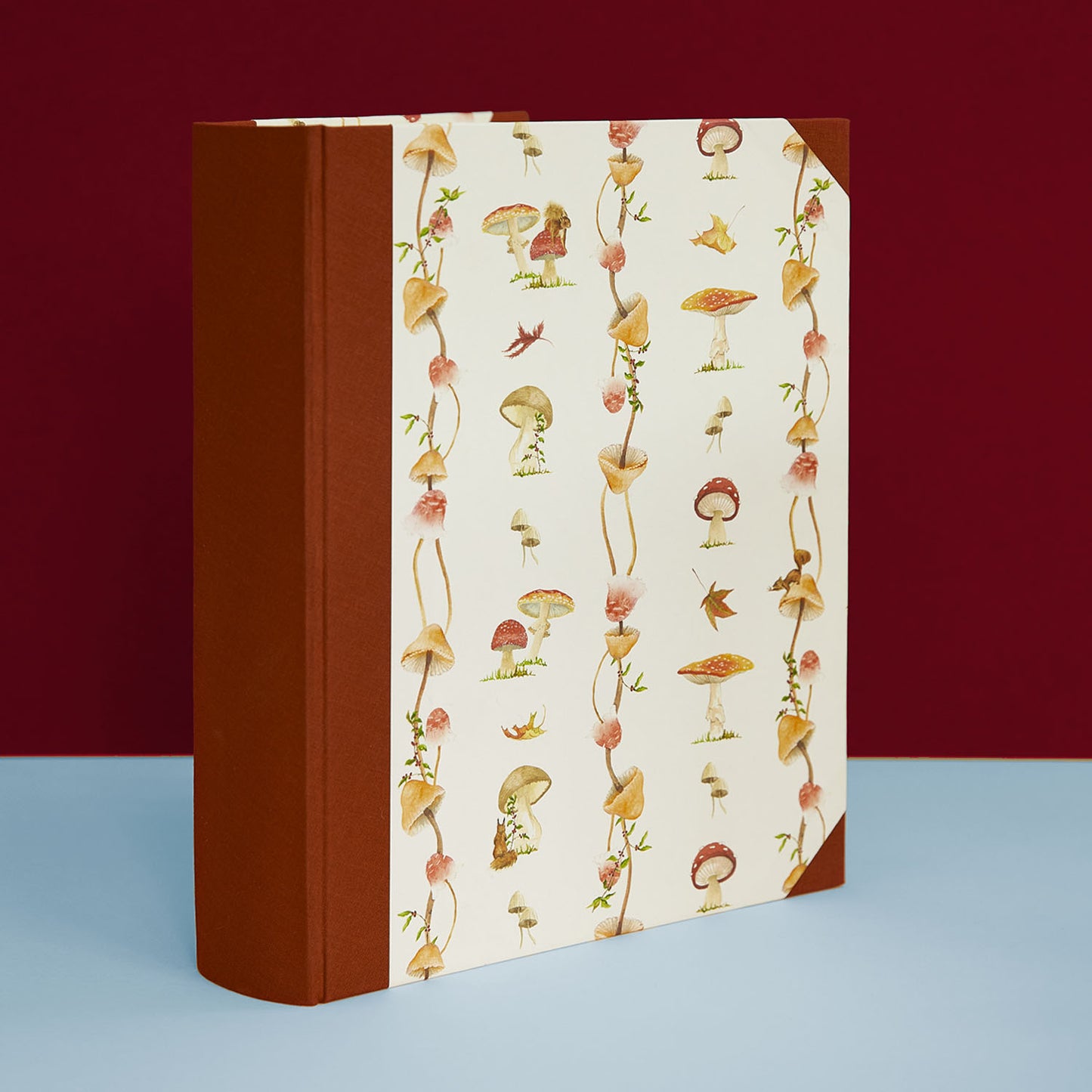 Personalised holiday photo album with mushroom cover, rustic country house accessory and cottage style addition.