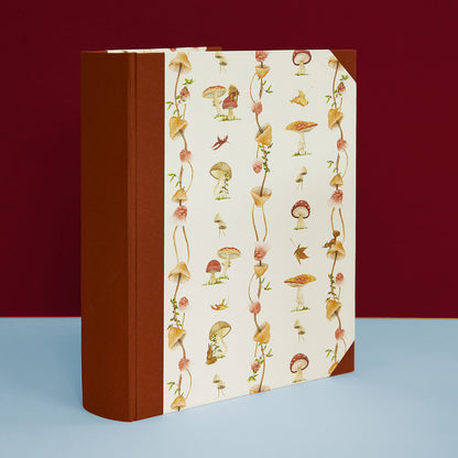 Personalised holiday photo album with mushroom cover, rustic country house accessory and cottage style addition.