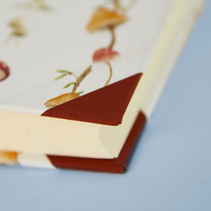 Rustic country home accessories detail: Forest Mushrooms personalised holiday photo album with cottage style design.