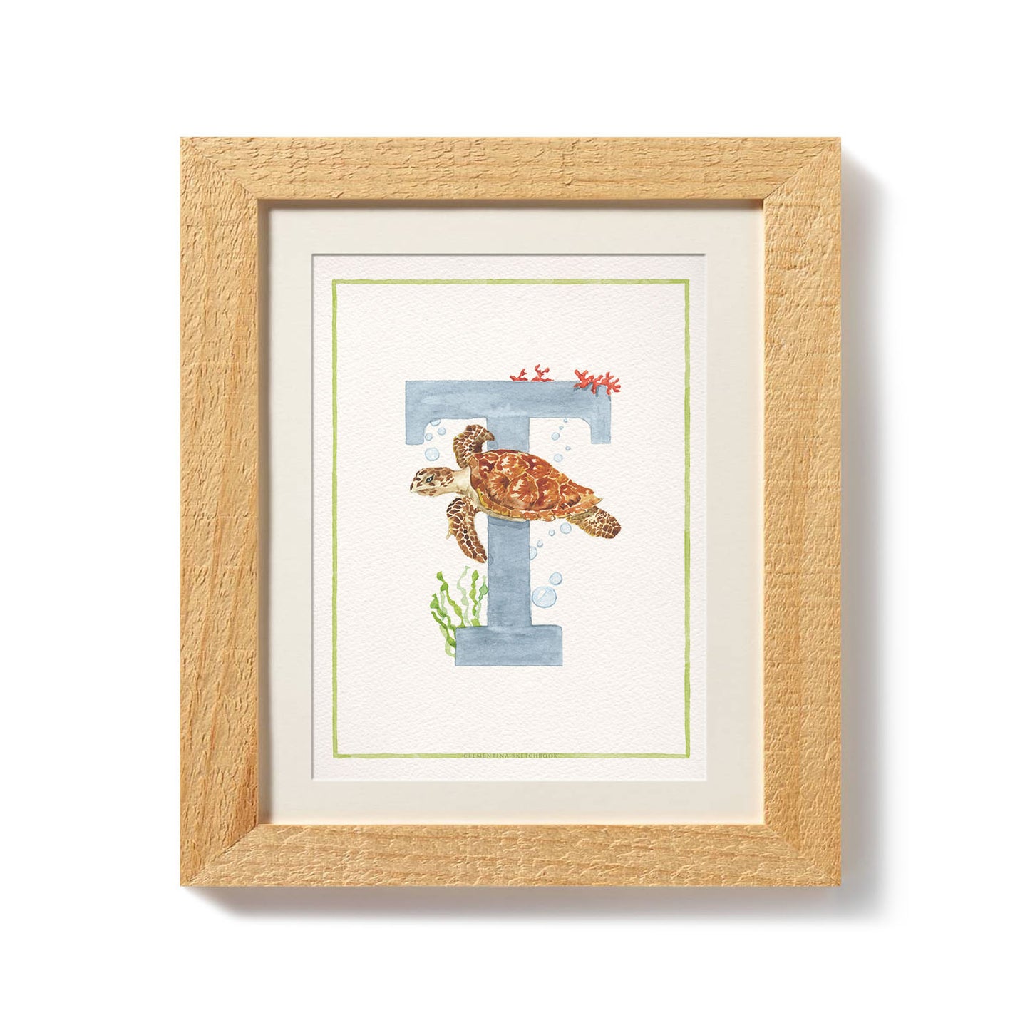 Close-up of the african animals print. This inital print features a unique watercolour design for the letter T, which has been placed in a wooden frame.