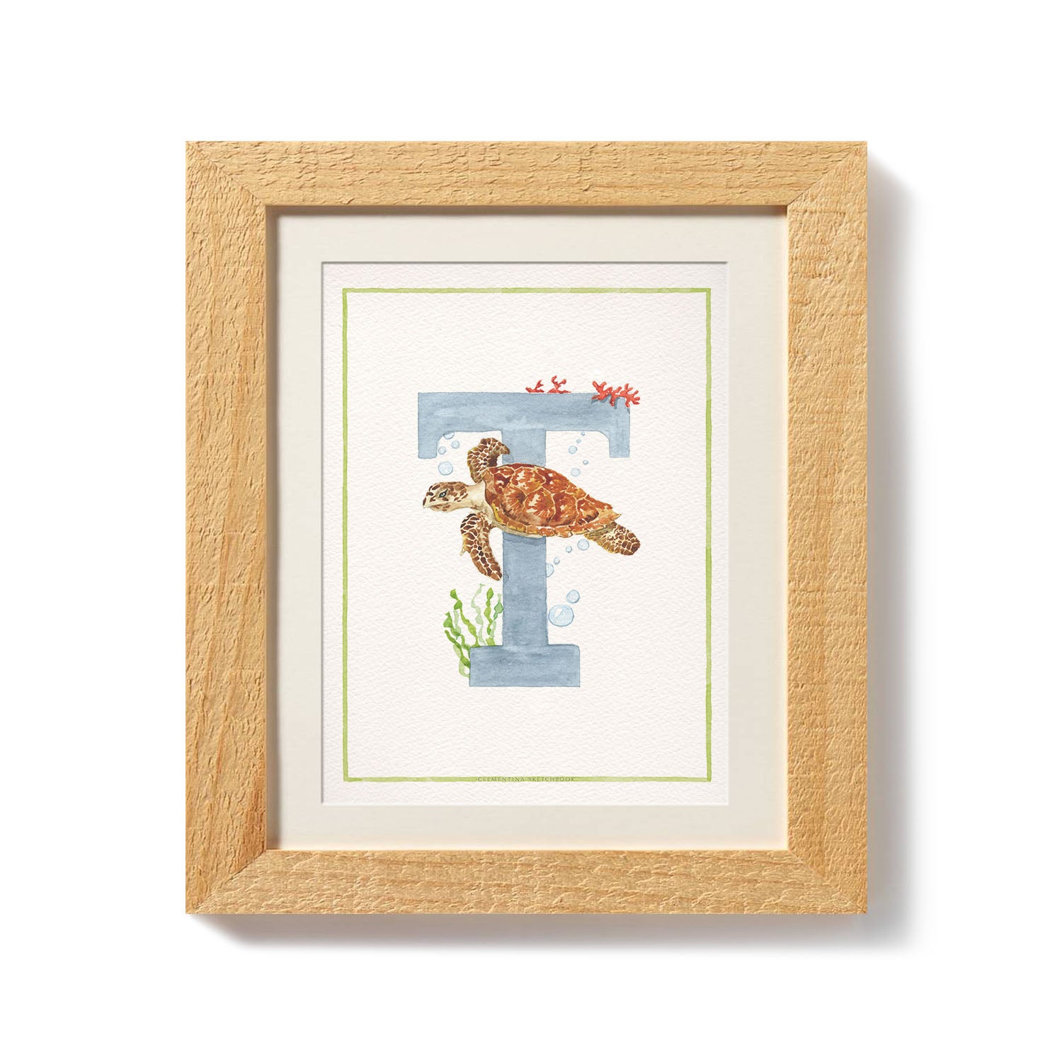 Close-up of the african animals print. This inital print features a unique watercolour design for the letter T, which has been placed in a wooden frame.