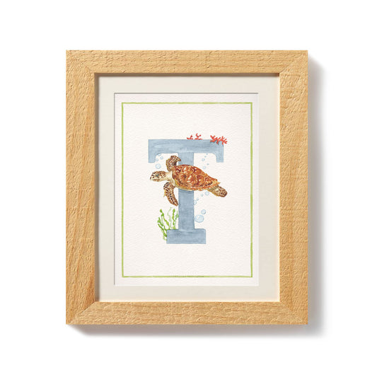 Close-up of the african animals print. This inital print features a unique watercolour design for the letter T, which has been placed in a wooden frame.