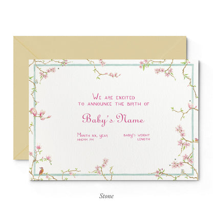 Image of Clementina Sketchbook's magnolia printed birth announcement with a pale blue and floral border, personalised text and sand envelope.