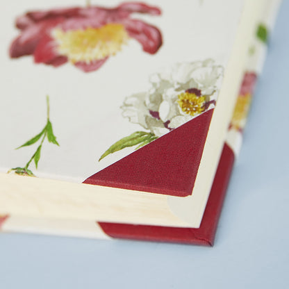 Detail of Peonies personalised photo album corner with hand-painted flowers, perfect as a memory book.