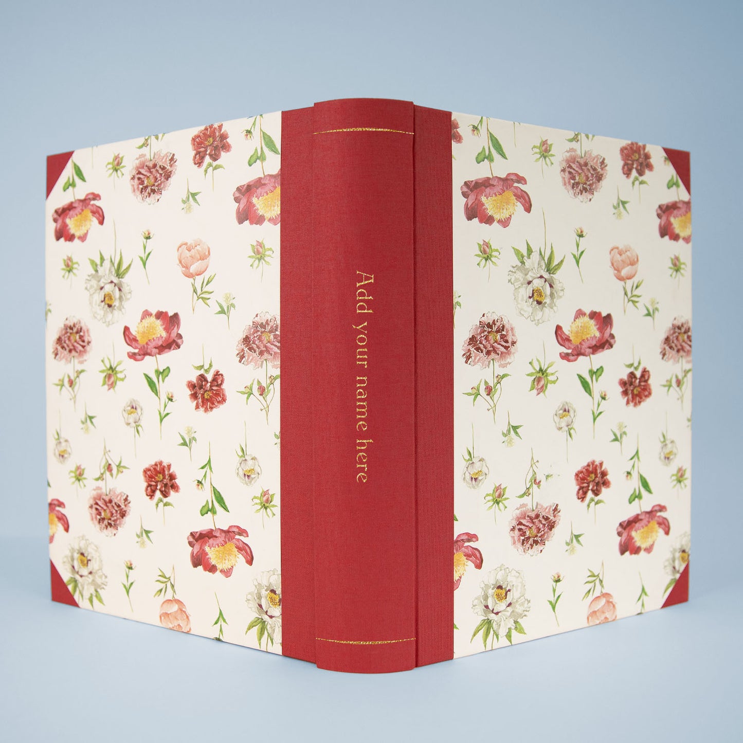 Peonies personalised photo album with Cherry Red binding and gold foiling option on the spine.