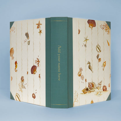 Open Shells on Shells personalised photo album with turquoise binding, showing gold foiling option on the spine, ideal as a wedding photo album or memory book.
