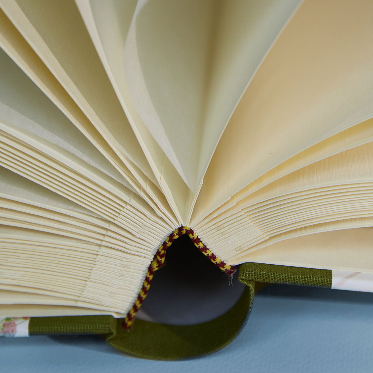 Close up of open Wild Blooms personalised photo album showing luxe Italian paper and binding.