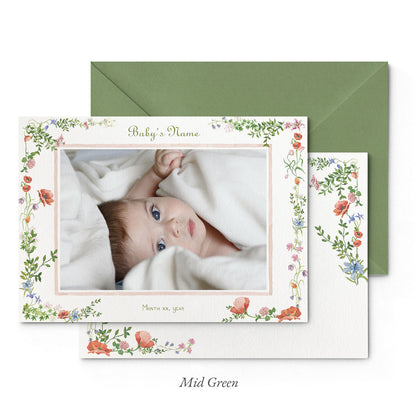 Image of both sides of Clementina Sketchbook's wild bloom printed birth announcement with a floral border, personalised text, space for a baby photo to be stuck and a green envelope.