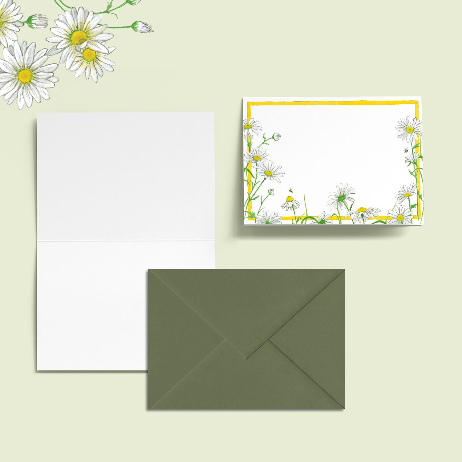 Image of the outside and inside of a Clementina Sketchbook Daisies mini personal stationery card, perfect for use as a wedding seating card, with floral watercolour designs and a mid-green envelope.