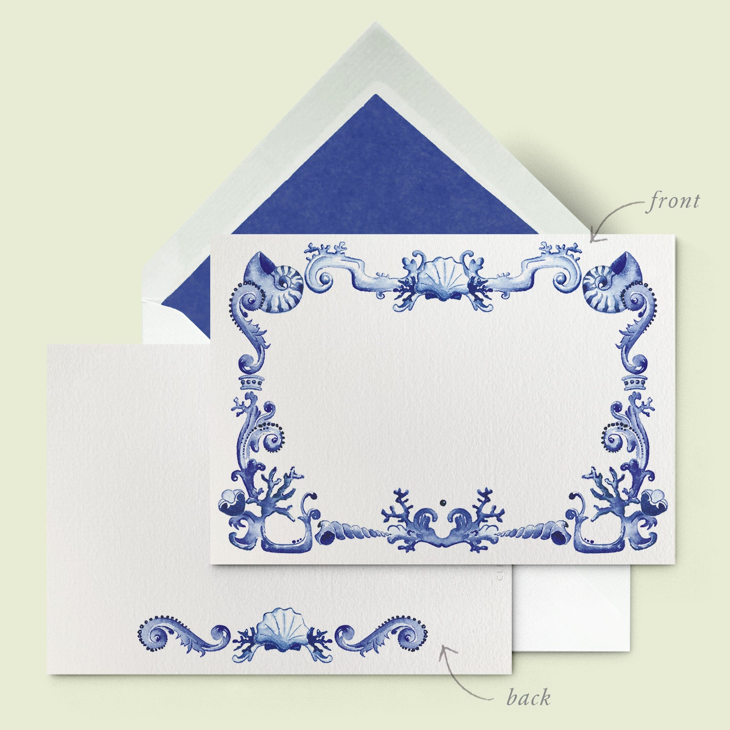 Close-up of a Clementina Sketchbook personalised stationery card, with a Portuguese-inspired blue and white watercolour design and a dark blue tissue envelope.