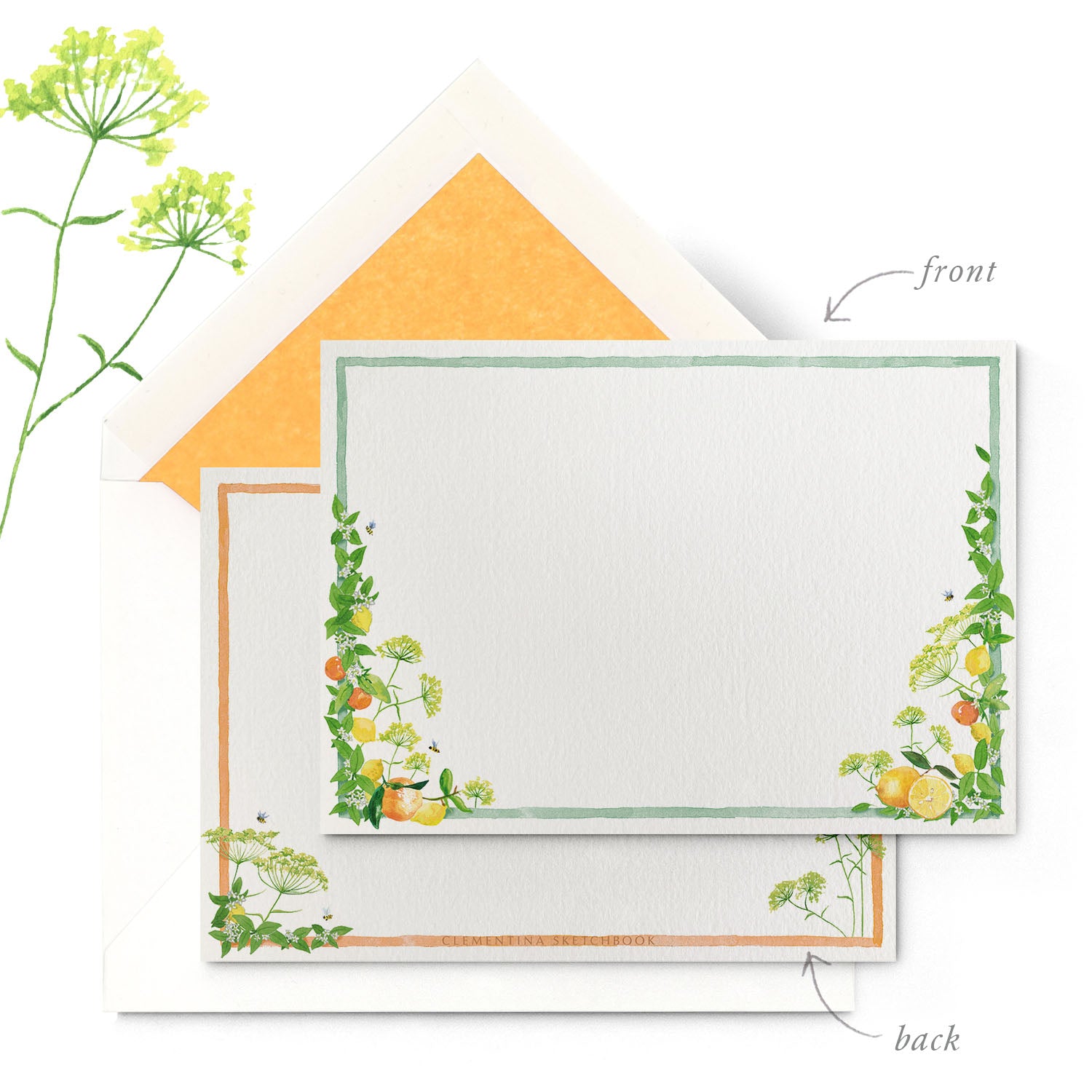 Close-up of a Clementina Sketchbook tuttifrutti stationery card, with a hand-painted flauna watercolour design, a green and orange border and a yellow tissue envelope.